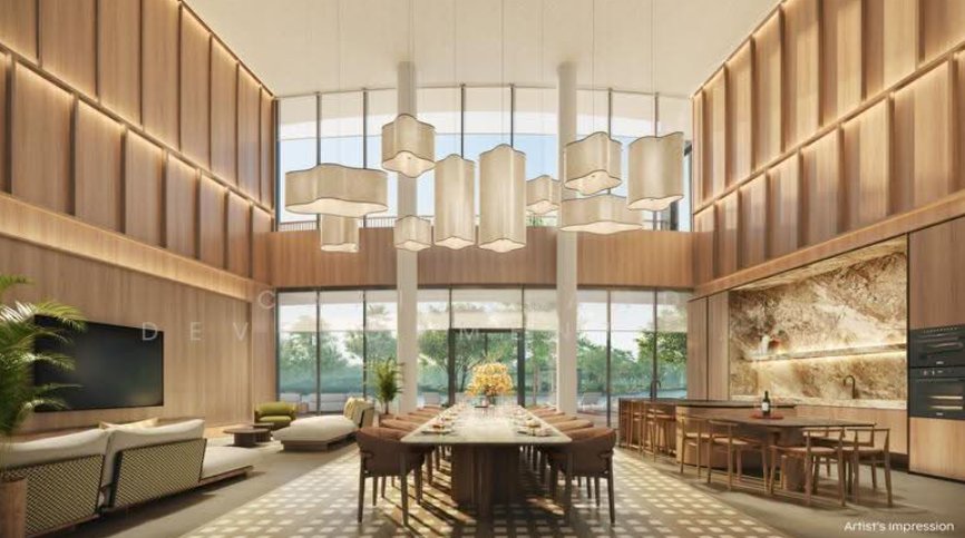 Double-height clubhouse dining room with a long table and open kitchen